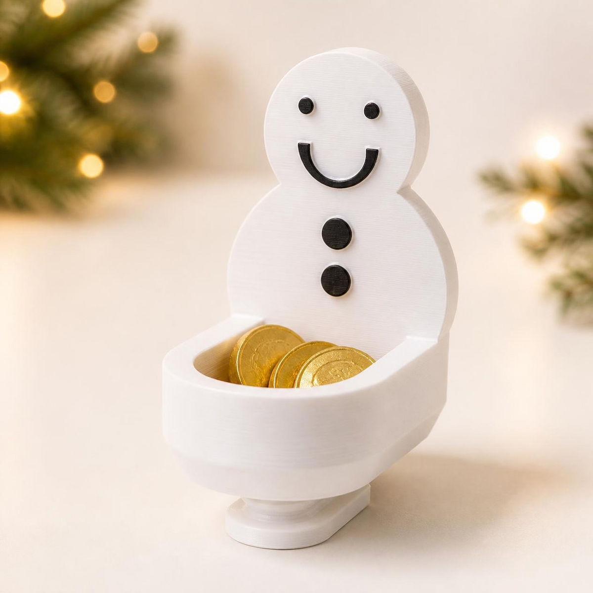 Physical 3D printed white Elf Toilet Christmas prop with snowman back and wrapped chocolate coins