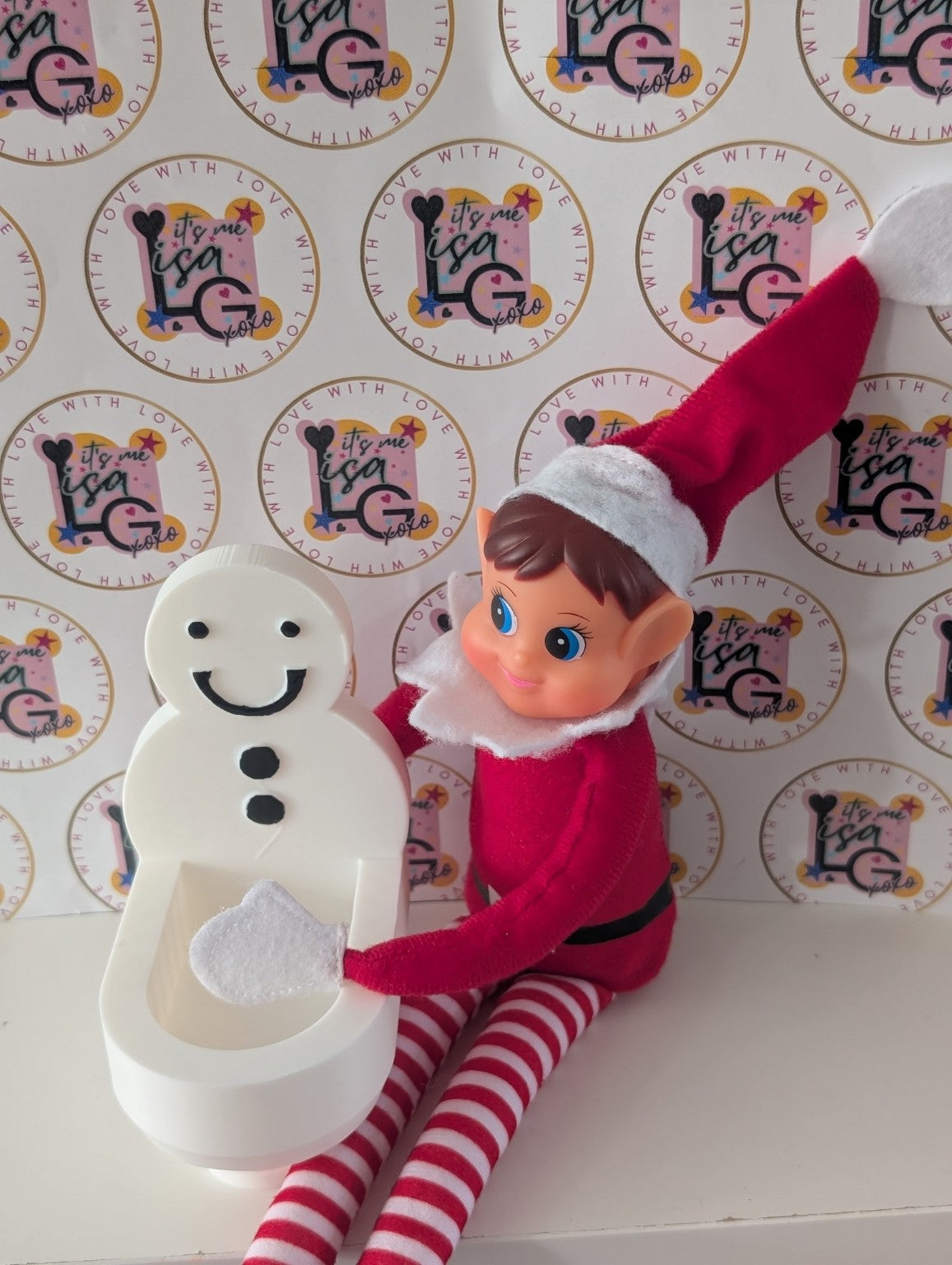 3D printed Elf Toilet Christmas prop shown with a Christmas elf for scale
